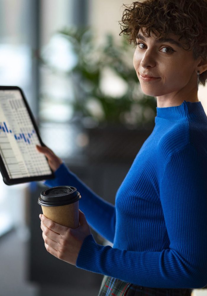person-office-analyzing-checking-finance-graphs-scaled-quxnnj4tt0bi68m0dv44p7rapwcmx0j8tlp7hi8tu8